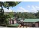 Scenic view of buildings nestled among lush trees and greenery, offering a tranquil environment at 50 Maple St, Roswell, GA 30075