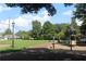 Neighborhood park featuring a playground, grassy area, and walking path at 50 Maple St, Roswell, GA 30075