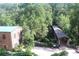 Historic mill building near a wooded area with a covered bridge over a small stream at 50 Maple St, Roswell, GA 30075