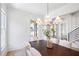 Elegant dining room featuring a contemporary chandelier and ample natural light at 50 Maple St, Roswell, GA 30075