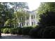 Traditional two-story home with white columns and lush landscaping at 50 Maple St, Roswell, GA 30075