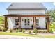 Charming home with a welcoming front porch featuring wooden columns and comfortable seating at 50 Maple St, Roswell, GA 30075