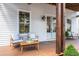 Inviting covered front porch with stylish seating, perfect for relaxing outdoors at 50 Maple St, Roswell, GA 30075