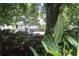 Picturesque gazebo in a park setting with lush greenery and colorful flowers at 50 Maple St, Roswell, GA 30075