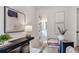 Stylish home office featuring a glass desk and a view into the bathroom at 50 Maple St, Roswell, GA 30075