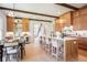 Spacious kitchen featuring an island with bar seating and modern lighting at 50 Maple St, Roswell, GA 30075