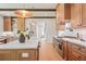 Modern kitchen with wood cabinets, quartz countertops, and stainless steel range at 50 Maple St, Roswell, GA 30075