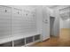 Well-organized mudroom with built-in storage, bench, and coat hooks at 50 Maple St, Roswell, GA 30075