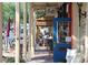 Charming outdoor dining area with bistro seating, storefronts, and a vibrant street scene at 50 Maple St, Roswell, GA 30075