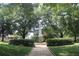 Stone monument surrounded by trees and manicured greenery in a serene park at 50 Maple St, Roswell, GA 30075