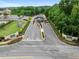 Aerial view of gated community entrance with lush landscaping and manicured grounds at 832 Chalet Hls, Mcdonough, GA 30253