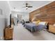 Comfortable bedroom with stylish wood accent wall, plush carpet, and ample space at 832 Chalet Hls, Mcdonough, GA 30253