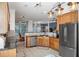 Modern kitchen featuring stainless steel appliances, granite countertops, and ample cabinet space at 832 Chalet Hls, Mcdonough, GA 30253