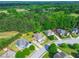 Aerial view of a home with a well-maintained lawn surrounded by lush greenery at 105 Tanners Ct, Covington, GA 30016