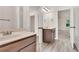 Bathroom featuring a vanity, mirror, and views of a bedroom at 105 Tanners Ct, Covington, GA 30016