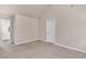 Bright bedroom featuring neutral walls and plush carpet at 105 Tanners Ct, Covington, GA 30016