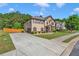 Charming two-story home with a well-manicured lawn, long driveway and inviting curb appeal at 105 Tanners Ct, Covington, GA 30016