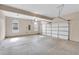 Spacious two-car garage with concrete flooring and ample space for parking and storage at 105 Tanners Ct, Covington, GA 30016