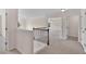 Hallway features carpet and access to rooms and stairwell at 105 Tanners Ct, Covington, GA 30016