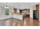 Gourmet kitchen featuring granite countertops, stainless steel appliances, and a breakfast bar at 105 Tanners Ct, Covington, GA 30016