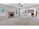 Inviting living room features a stone fireplace and abundant natural light at 105 Tanners Ct, Covington, GA 30016