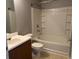 Bathroom with tub/shower combo, single sink vanity, and neutral tones at 14301 Waldrop Cv, Decatur, GA 30034