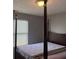 Cozy bedroom features a queen bed frame and a window at 14301 Waldrop Cv, Decatur, GA 30034