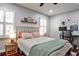Comfortable bedroom with a desk, large window, and closet at 2474 Lehaven Dr, Tucker, GA 30084