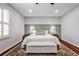 Spacious bedroom featuring a decorative rug, bench, and bright window at 2474 Lehaven Dr, Tucker, GA 30084