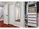 Well-organized closet with built-in shelving and mirrored door at 2474 Lehaven Dr, Tucker, GA 30084
