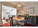 Cozy dining area with elegant lighting, stylish seating and connection to the living area at 2474 Lehaven Dr, Tucker, GA 30084