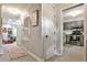 Hallway view with light grey walls connecting to a kitchen and living area at 2474 Lehaven Dr, Tucker, GA 30084