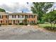 Traditional brick townhouse with manicured landscaping and ample parking at 2474 Lehaven Dr, Tucker, GA 30084