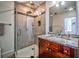 Modern bathroom with glass shower, granite countertop, and ample storage space at 57 Forsyth Nw St # 12B, Atlanta, GA 30303