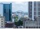 View of city buildings and a large Ferris wheel from an elevated vantage point at 57 Forsyth Nw St # 12B, Atlanta, GA 30303