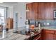 Well-appointed kitchen features wood cabinets, granite countertops, and modern appliances at 57 Forsyth Nw St # 12B, Atlanta, GA 30303