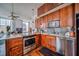 Charming kitchen boasts stainless steel appliances, granite countertops, and rich wood cabinetry at 57 Forsyth Nw St # 12B, Atlanta, GA 30303