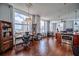 Sunlit living room with an open kitchen, hardwood floors, and large windows with city views at 57 Forsyth Nw St # 12B, Atlanta, GA 30303