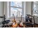 Comfortable living space with guitars, music equipment, and a large window with city views at 57 Forsyth Nw St # 12B, Atlanta, GA 30303
