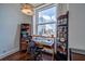 Cozy office featuring hardwood flooring, stylish desk, and a large window with city views at 57 Forsyth Nw St # 12B, Atlanta, GA 30303