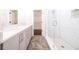 Modern bathroom with double vanity, white subway tile shower, and tiled floors at 915 Katie Kerr Drive, Decatur, GA 30030