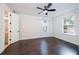 Bedroom with dark wood floors, ceiling fan, and ensuite bathroom at 915 Katie Kerr Drive, Decatur, GA 30030