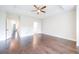 Large bedroom with hardwood floors, trey ceiling, and multiple doorways at 915 Katie Kerr Drive, Decatur, GA 30030