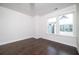 Bright bedroom with hardwood floors and two windows offering natural light at 915 Katie Kerr Drive, Decatur, GA 30030