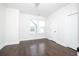Bedroom with hardwood floors, two windows, and white doors at 915 Katie Kerr Drive, Decatur, GA 30030