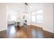 Dining area with hardwood floors, kitchen and natural light from large windows at 915 Katie Kerr Drive, Decatur, GA 30030
