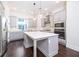 Modern kitchen featuring gray cabinets, stainless steel appliances, and a spacious island at 915 Katie Kerr Drive, Decatur, GA 30030