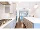 Open kitchen with modern appliances, ample counter space and view of the dining and living area at 915 Katie Kerr Drive, Decatur, GA 30030