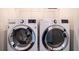 Laundry room featuring a side-by-side, front-load LG washer and dryer set at 915 Katie Kerr Drive, Decatur, GA 30030