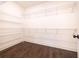 Walk-in closet with ample wire shelving and hardwood floors at 915 Katie Kerr Drive, Decatur, GA 30030